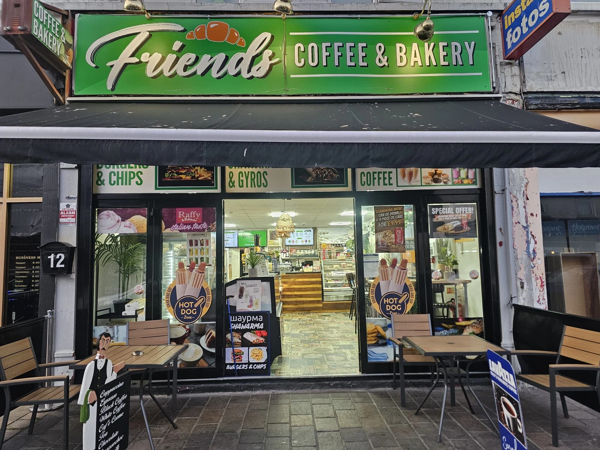 Inside Friends Coffee & Bakery — warm lighting, freshly brewed coffee and baked goods